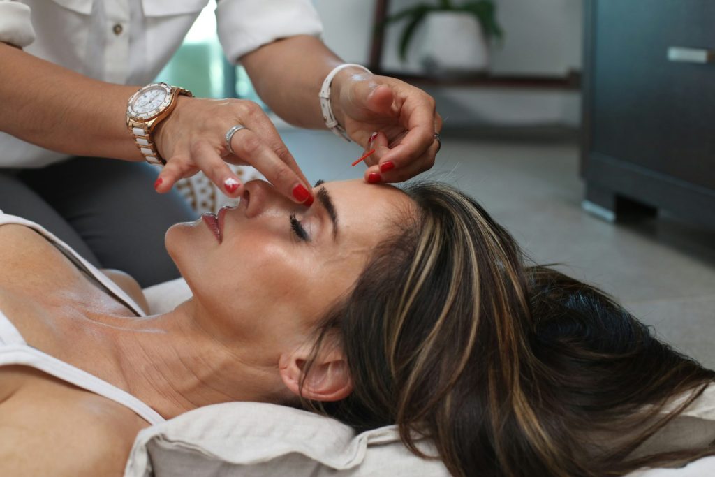 Why Lymphatic Drainage Facial Benefits Are the Secret to Glowing Skin Photo - A woman getting a facial due to the Lymphatic Drainage Facial Benefits