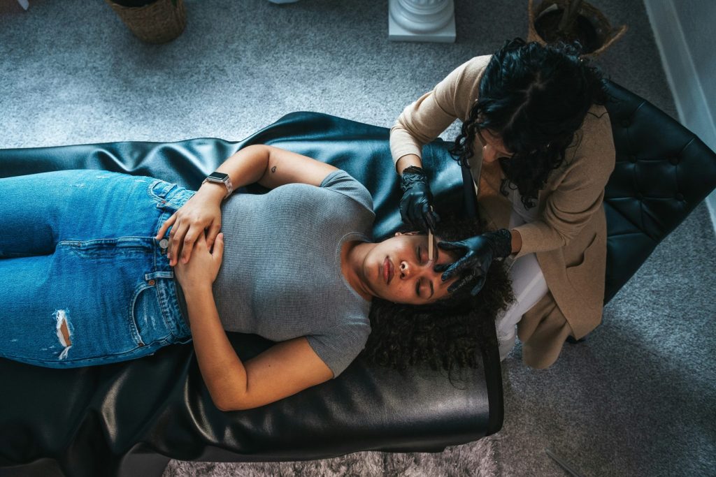 The Science Behind PRP Facials: How This Revolutionary Treatment Rejuvenates Your Skin A woman getting a PRP therapy the doctor is also helping her with Understanding The Science Behind PRP Facials